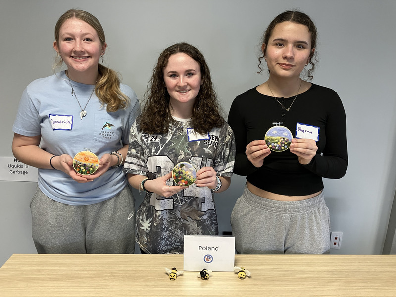 Students posing with needle felting work