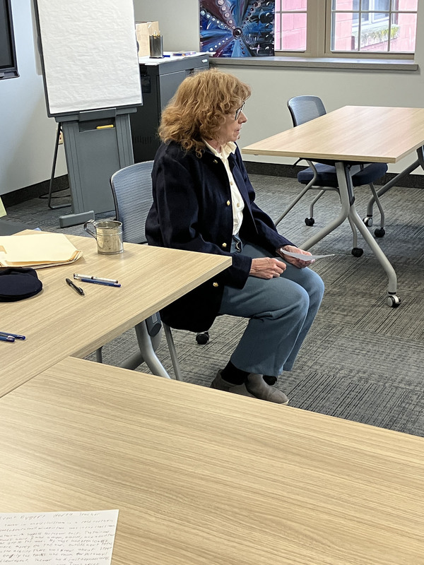 People sitting at tables during Civil War workshop and presentations