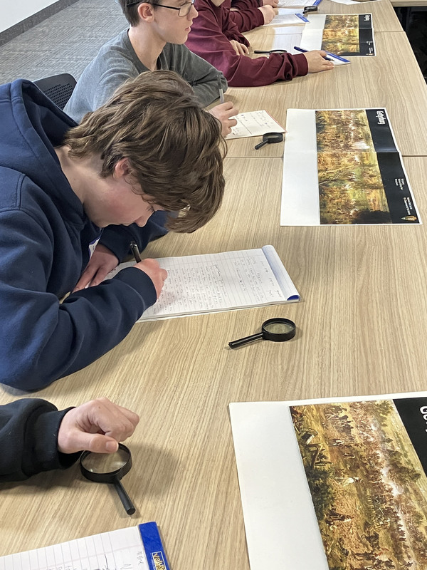 People sitting at tables during Civil War workshop and presentations