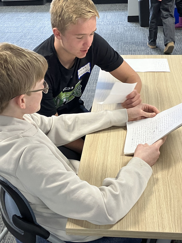 People sitting at tables during Civil War workshop and presentations