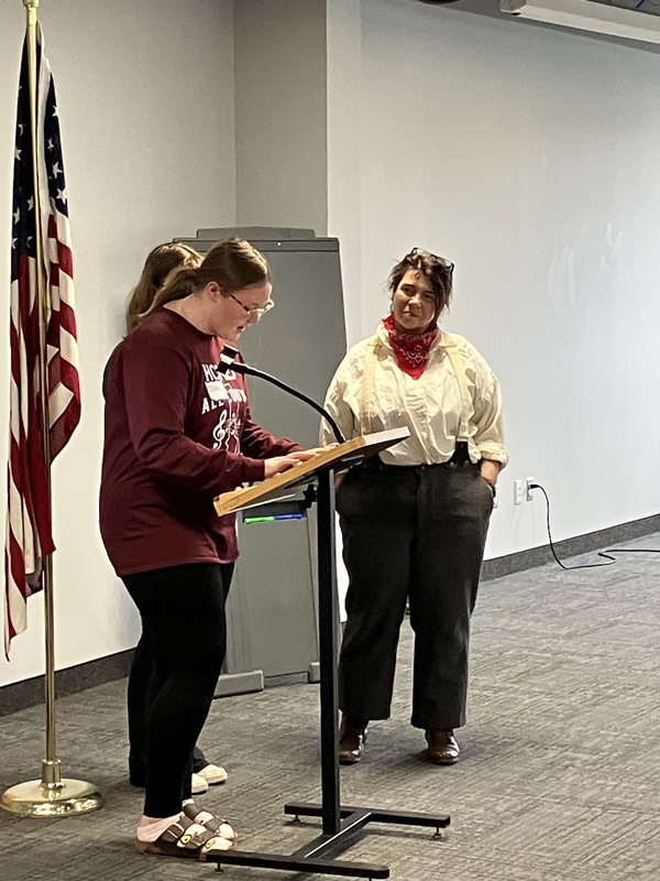 Person presenting about Civil War as another person looks on