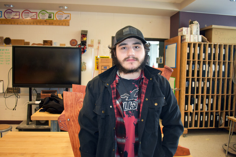 Student Michael Grecco posing in Trade Industries classroom