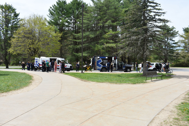 Health Science Careers students, Criminal Justice students, Health Science teachers and MOVAC employees tour ambulances and fly car outside