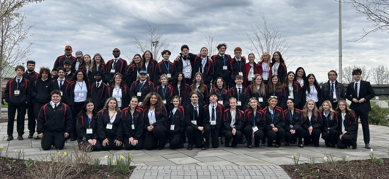 Many Herkimer BOCES students posing together outside in SkillsUSA outfits
