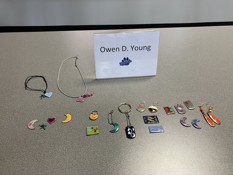 Jewelry and a sign saying Owen D. Young
