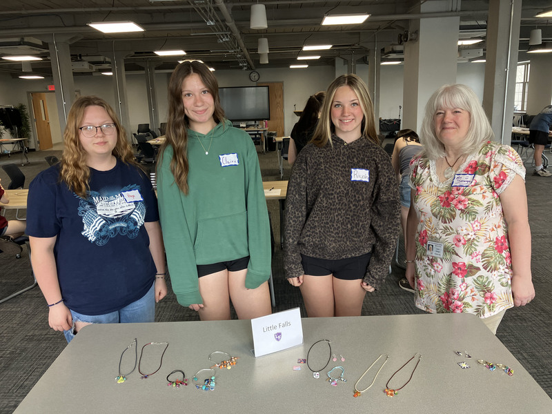 Three students and a staff member