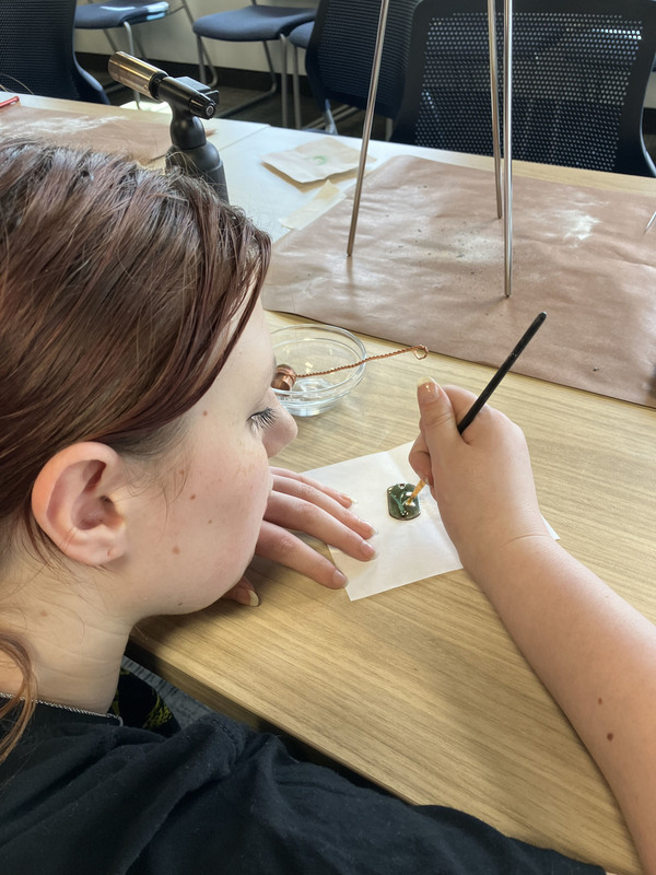 Student working on art/jewelry project
