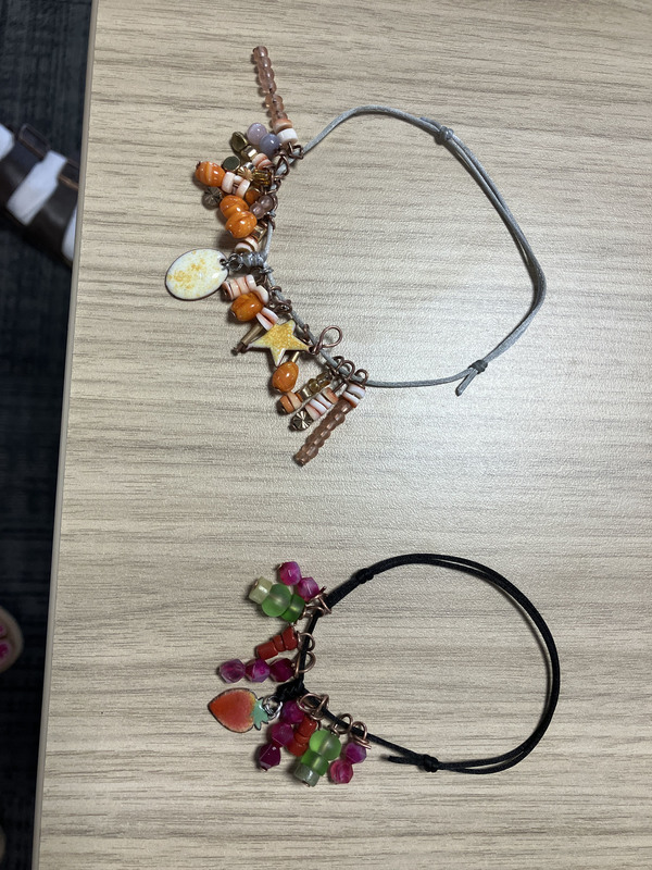 Two bracelets with multiple colors and shapes