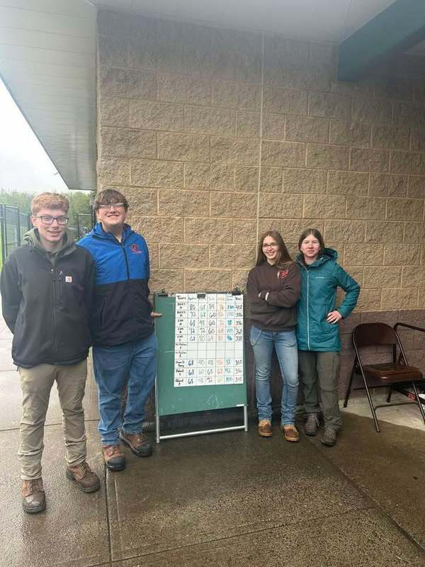 Four Conservation students posing outside at Envirothon