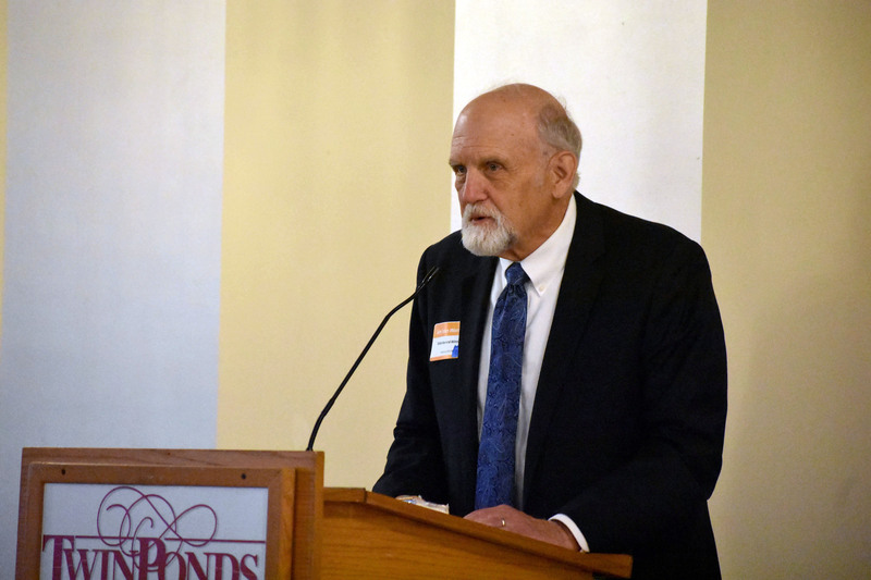 James Van Wormer speaking at a podium