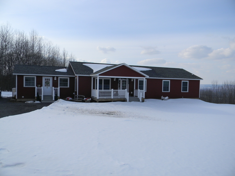 A modular home built by Herkimer BOCES students is pictured in the snow in Ilion