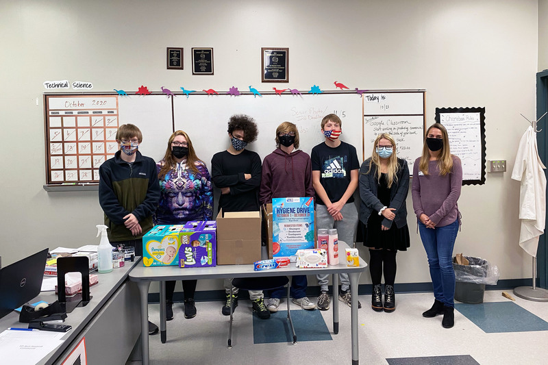 VP-TECH Council students pose with a United Way representative and hygiene items that were donated