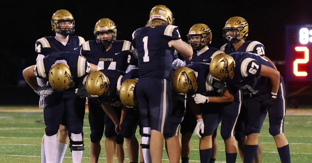 Hermantown Football huddle