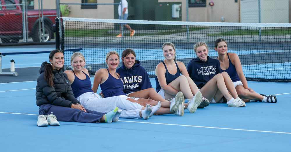 Hermantown girls tennis team smiles for the camera