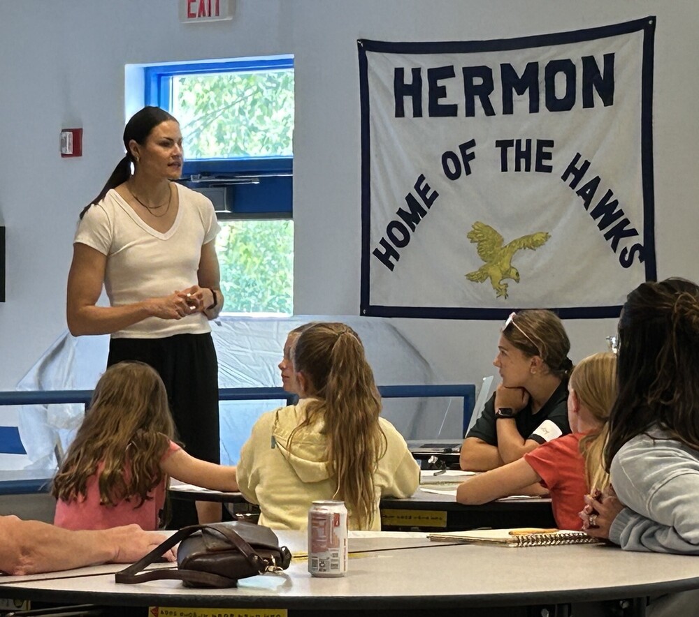 Coach Bre Smedley speaks with Hermon female athletes