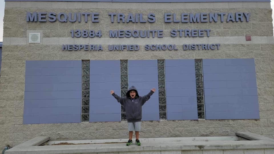 Students in front of school