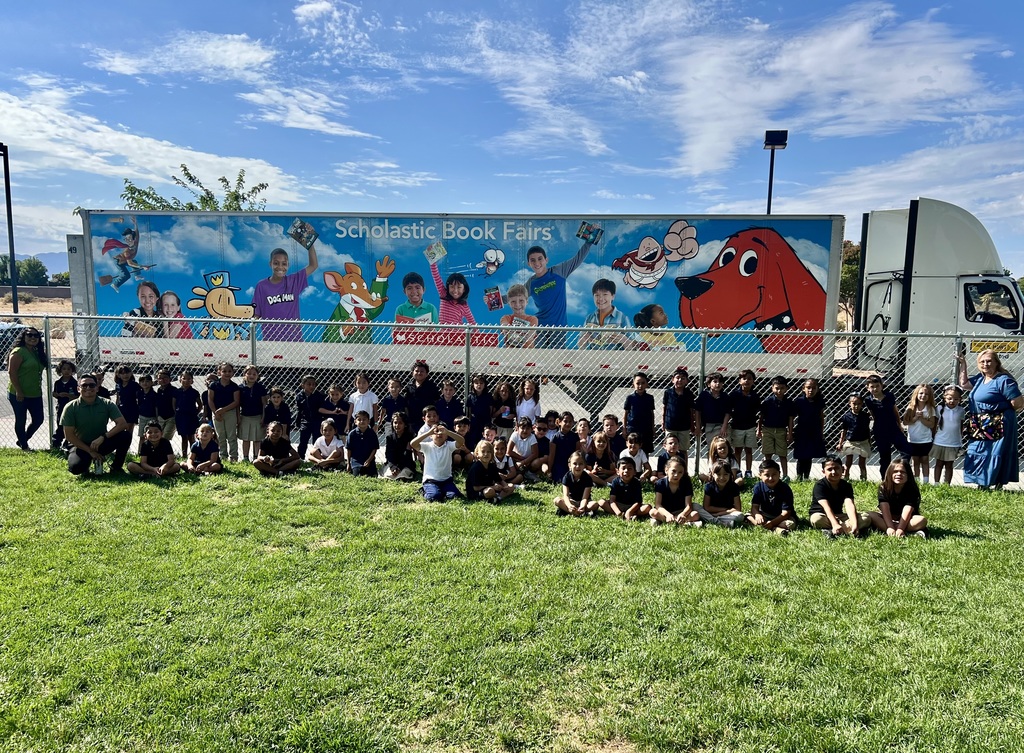 students in front of a truck