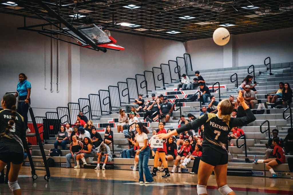 HHS volleyball player serves the ball