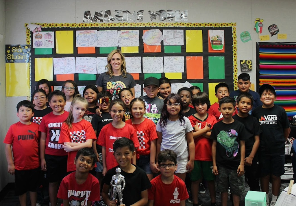 Picture of Ms. Herrera's class posing for being this week's attendance winners.