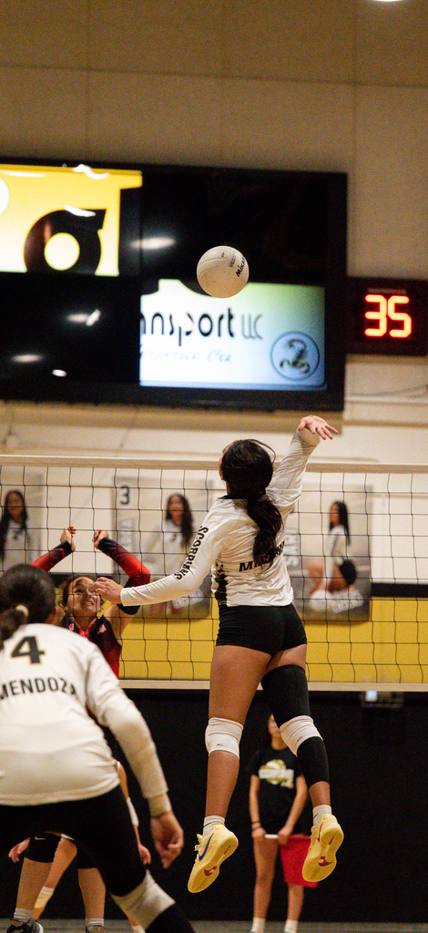 HHS Player spikes the ball