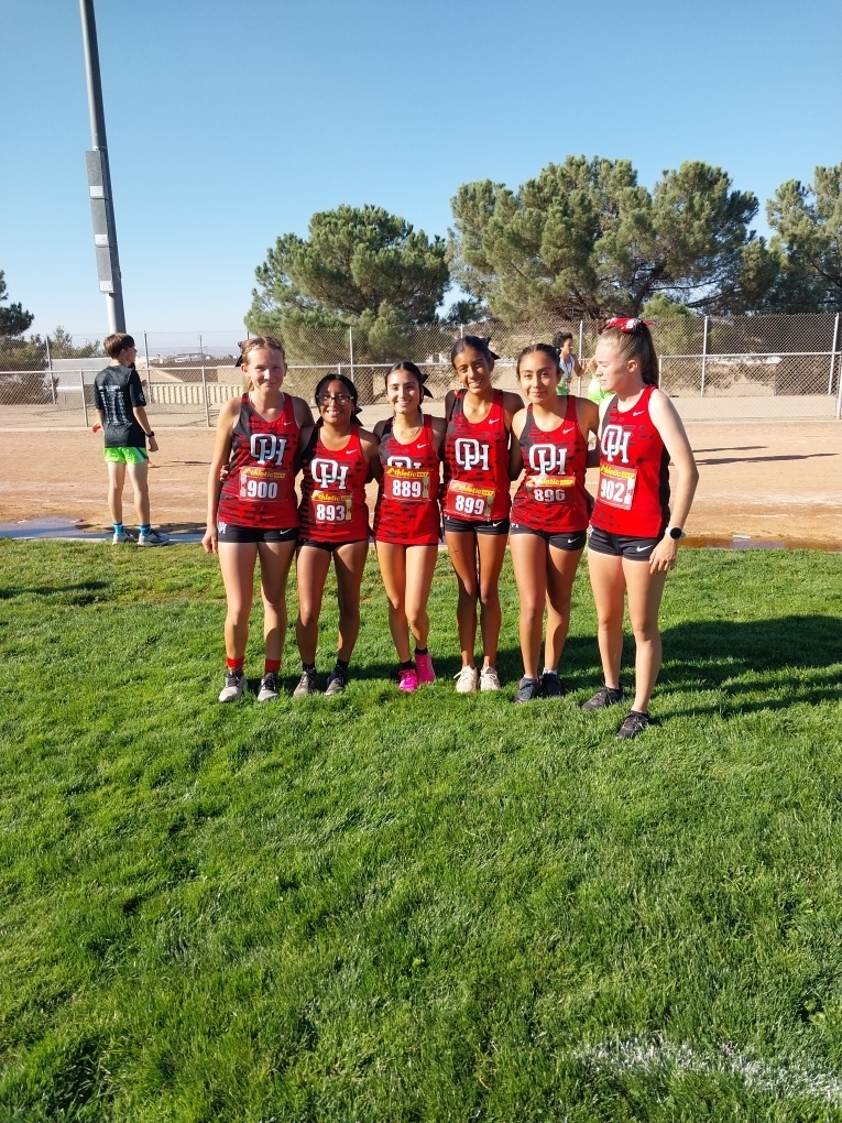 Lady Bulldog cross country runners  take a picture after the race.