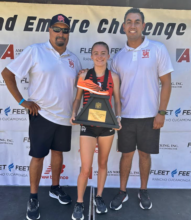 Sadie Sherrodd with Coaches N. Yglesias and B. Yglesias