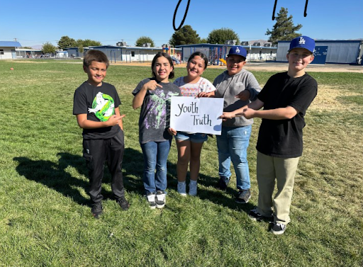 students holding a sign