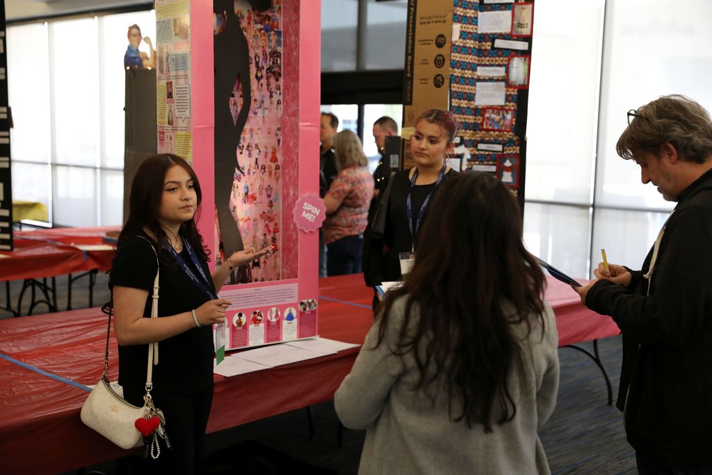 students with Barbie history exhibit