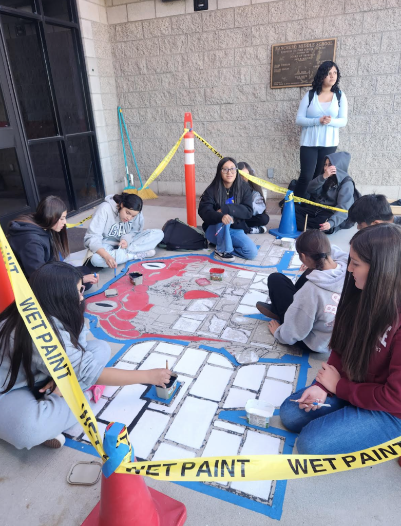 art students painting mural