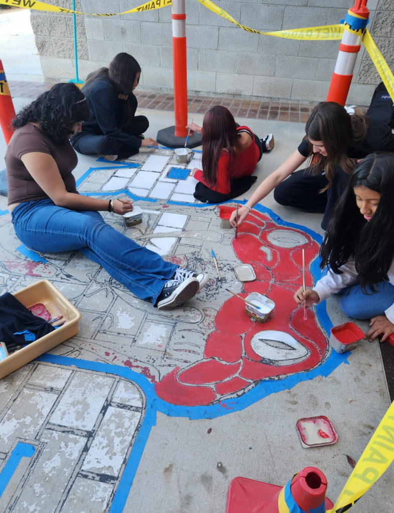 art students painting mural