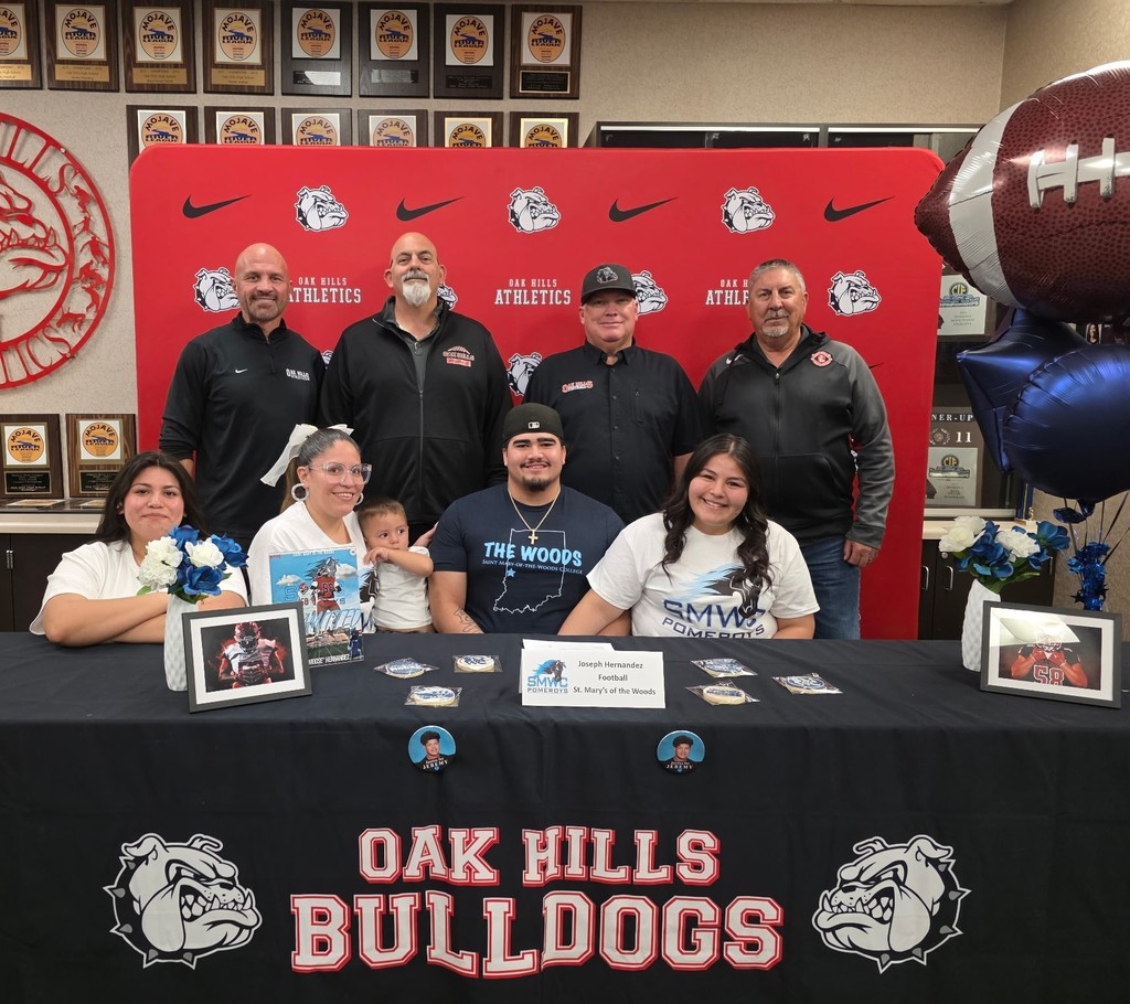 Oak Hills High School proudly celebrates one of its finest as star football standout Joseph “Moose” Hernandez takes the next step in his journey, signing with St. Mary’s of the Woods!  A true force on the field, Moose was a cornerstone of Bulldog football, bringing power, grit, and relentless determination every Friday night. His impact helped drive Oak Hills to an incredible milestone: the program’s 5th consecutive Mojave River League Championship, cementing his legacy as part of a dominant era.  Moose, your hard work, leadership, and passion have set the standard. The entire Bulldog community is behind you as you head to Indiana to continue your academic and athletic career.  It's a great day to be a Bulldog!