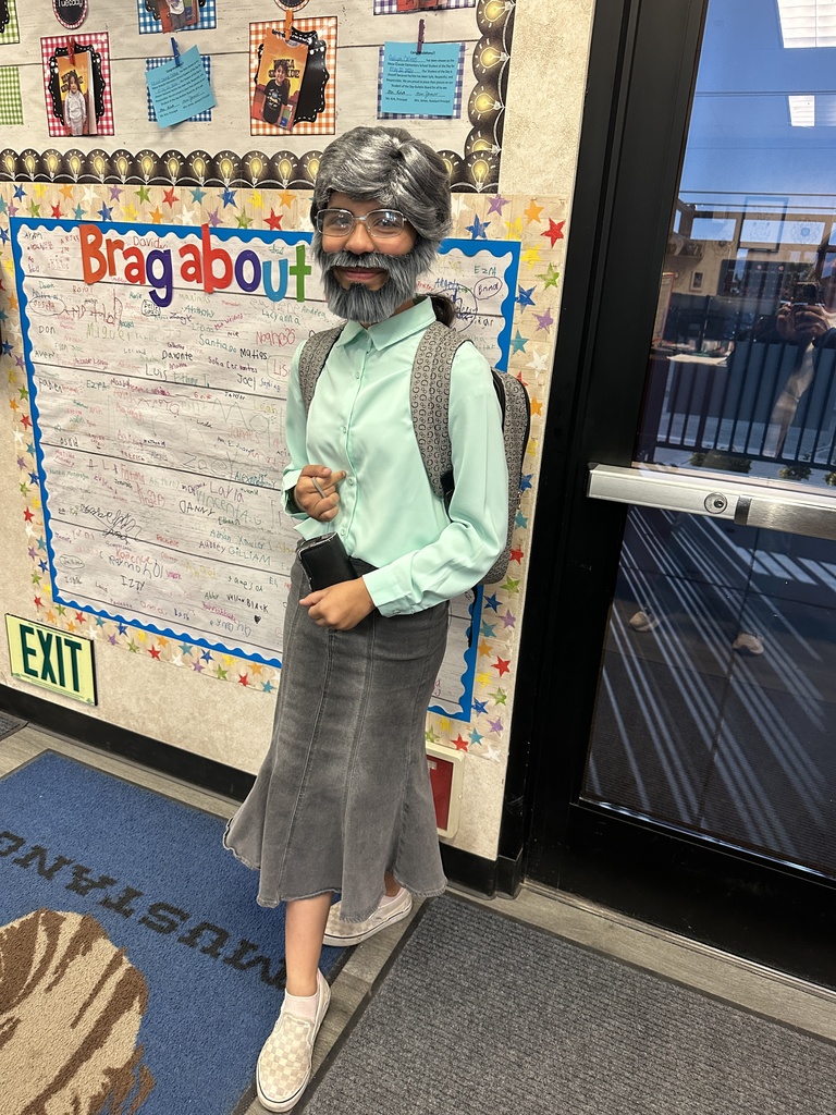 Students  and staff dressed as Mr. Kirk