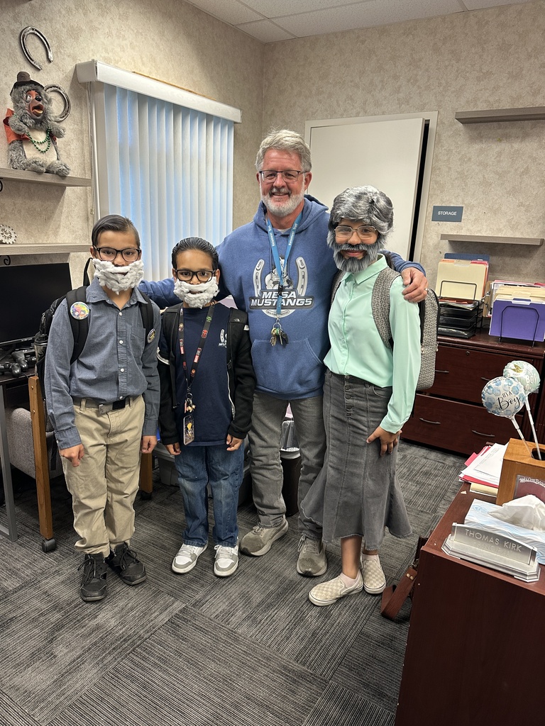 Students  and staff dressed as Mr. Kirk