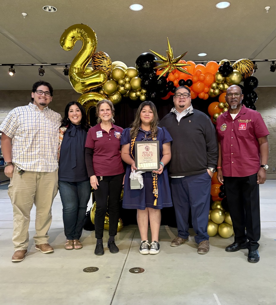 Elk Essay award presentation to student