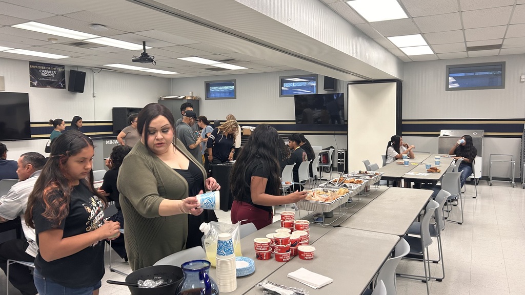 Group of people in line to get food