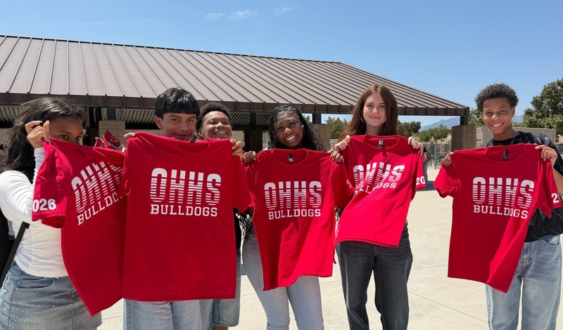 Students holding OHHS shirts.