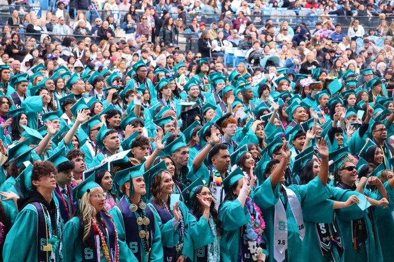 Students standing at graduation.