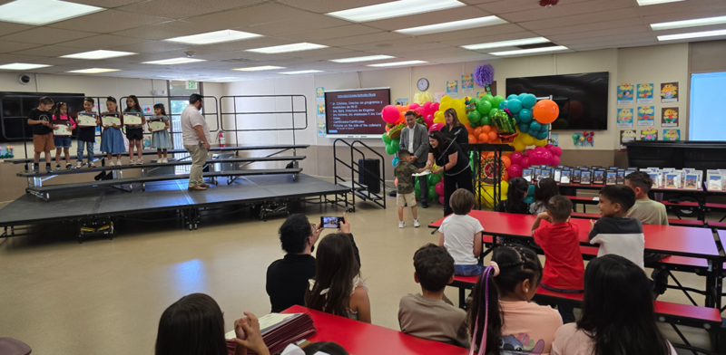 Parents, students, and staff coming together to celebrate our DLI program
