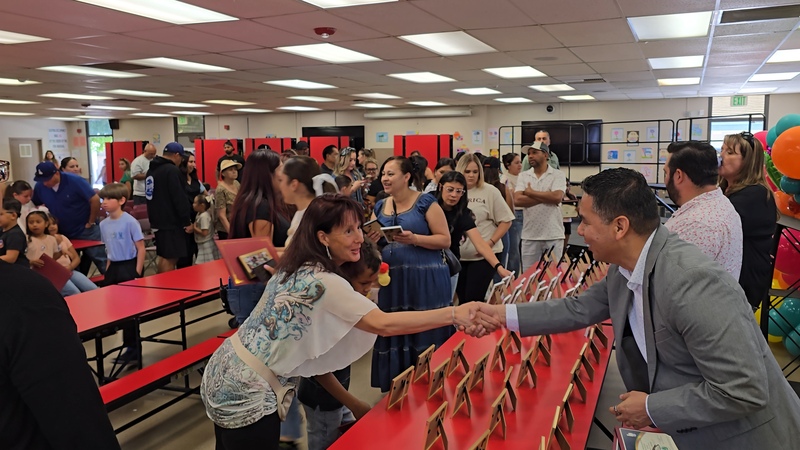 Parents, students, and staff coming together to celebrate our DLI program