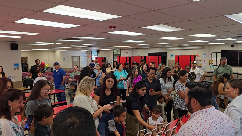 Parents, students, and staff coming together to celebrate our DLI program