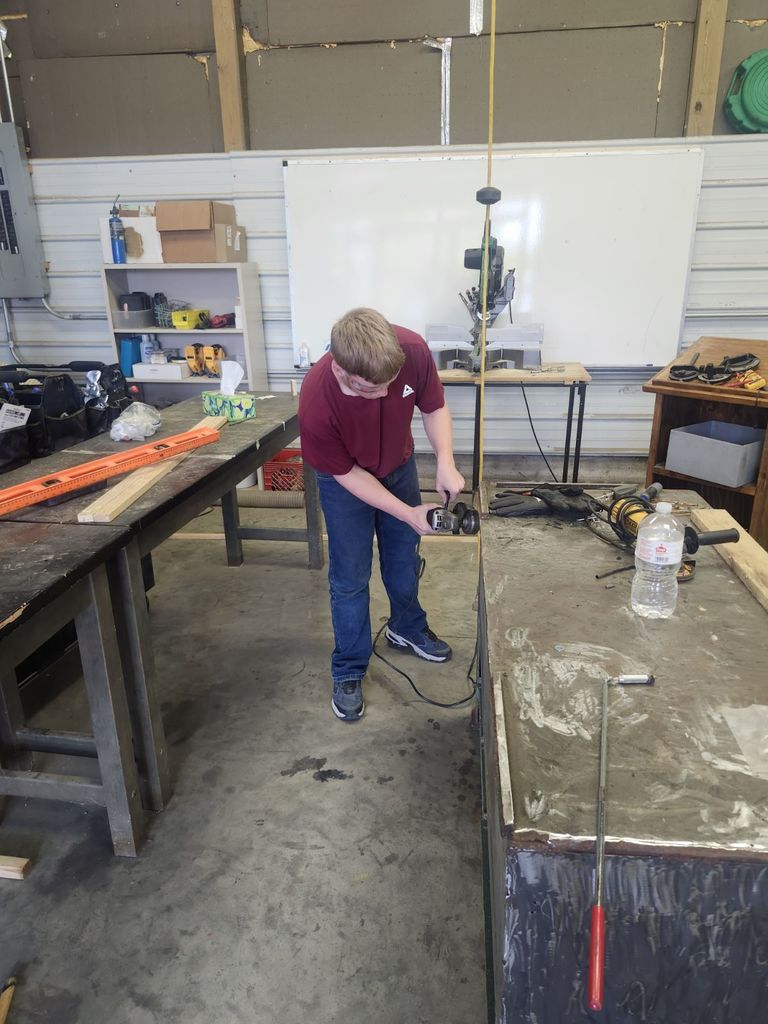 Cleaning a rusted table to prepare for paint