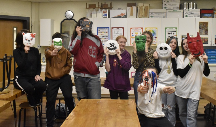 The 8th grade students made masks for Halloween .