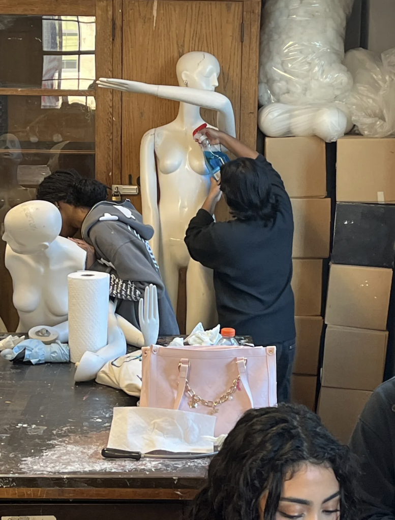 Cleaning mannequins in advance of the new window displays