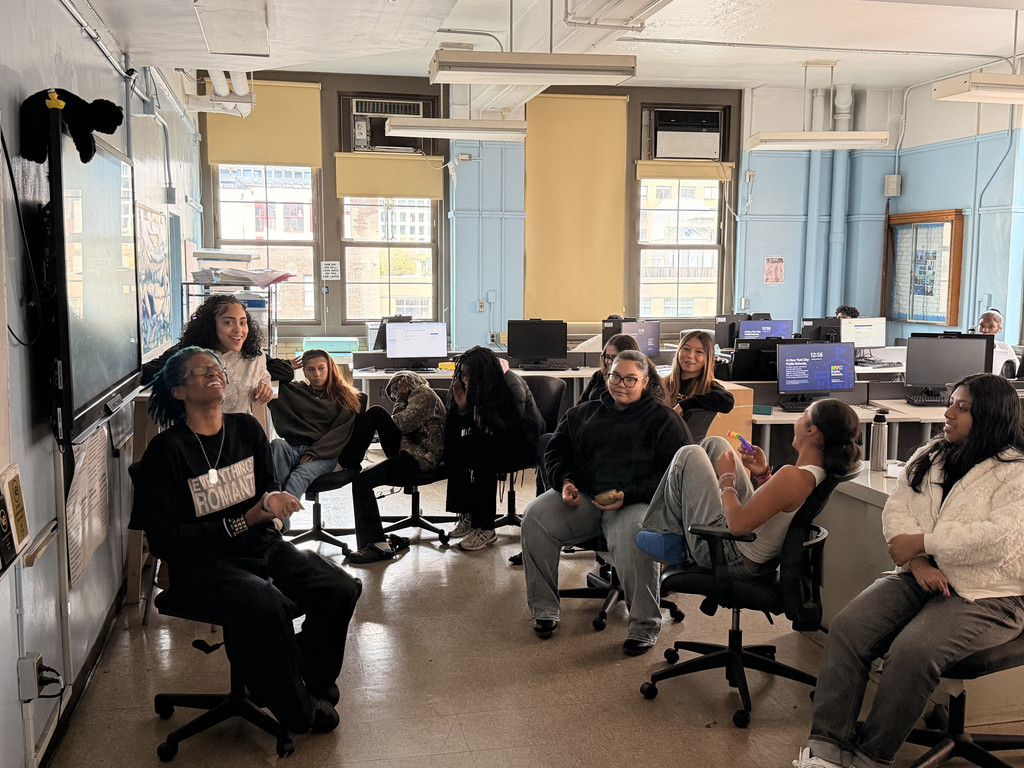 Community Building in Our Financial Literacy Class Students engage in a class circle where they discuss their personal and academic struggles, fostering strong bonds among each other outside the traditional educational environment.
