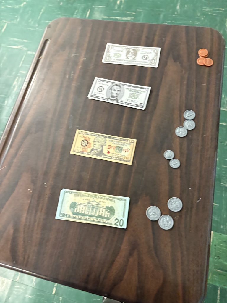 NOCTI THURSDAY! Our juniors have their “cash registers” set up and practicing their cash handling: counting forward skills 💵