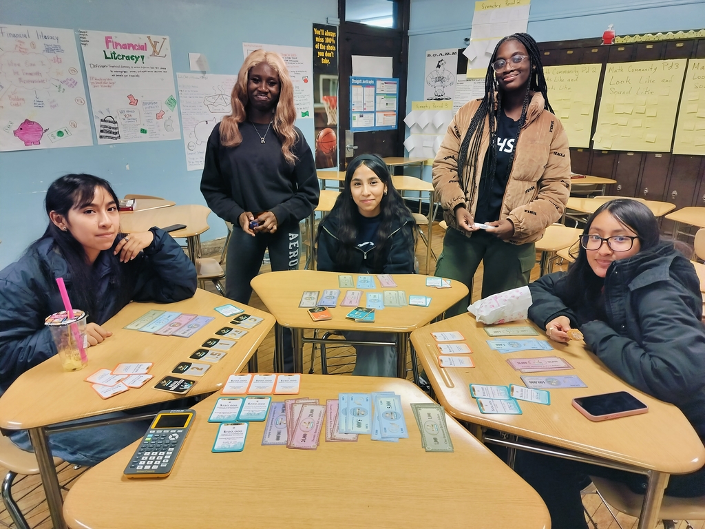 The Financial Literacy Club having fun and playing "BeFree for Starters" game to learn about loans and investments.