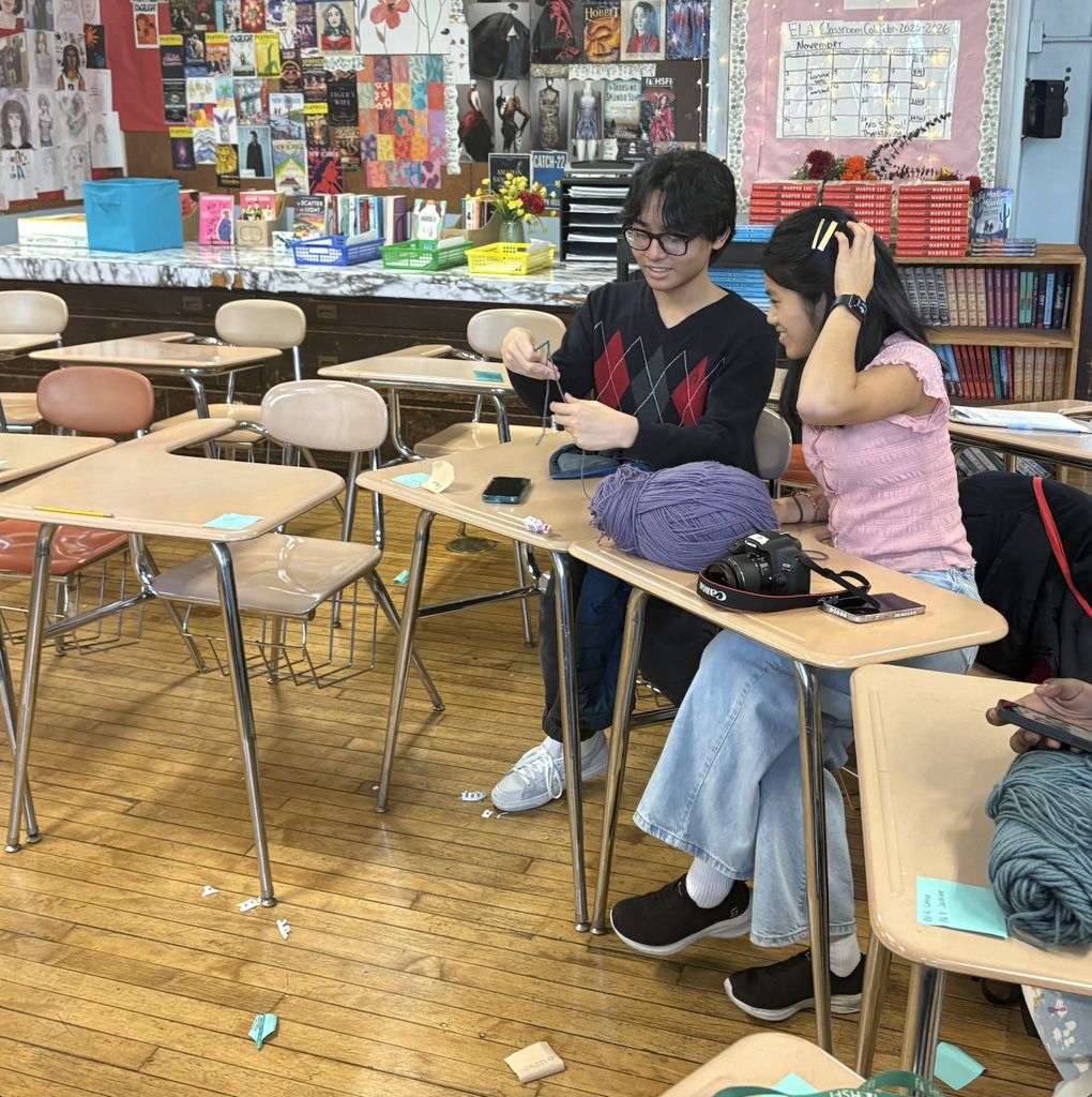 Rebecca teaching a new student how to crochet!