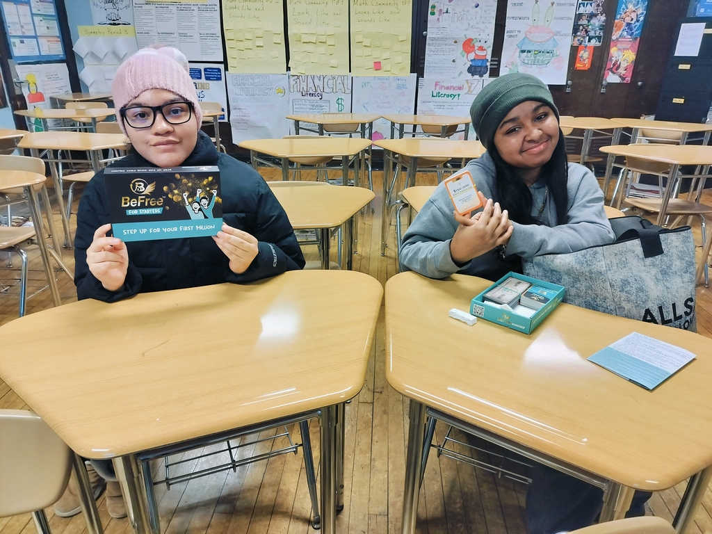 Students discussing investing in the Financial Literacy Club.