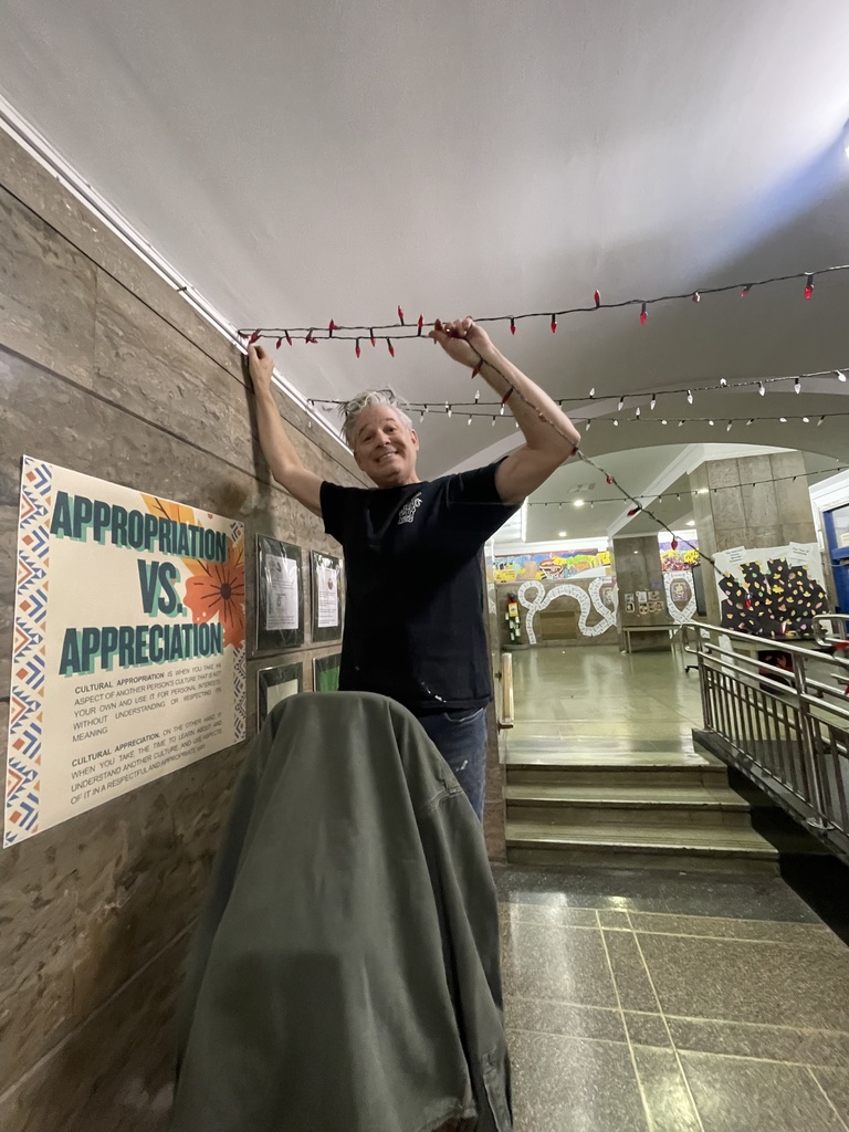 Mr. Rosenthal putting up lights