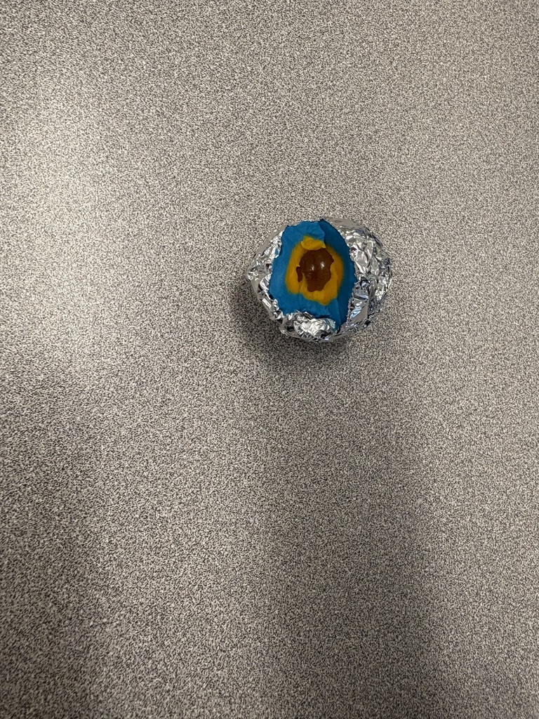 Our 5th grade students are diving into the layers of the Earth! 🌍 To kick off the week after spring break, they created hands-on models using marbles, play-dough, and aluminum foil. The activity was a big hit—students loved getting a close-up look at what’s beneath the Earth’s surface!